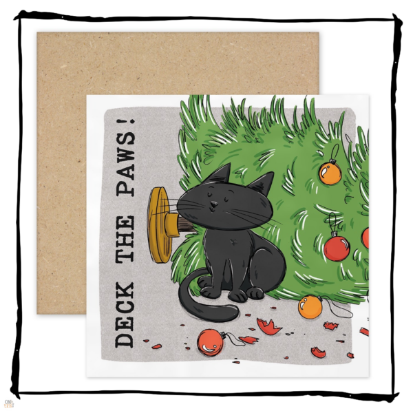 black cat sitting beside a fallen Christmas tree and broken baubles on a Deck the Paws Christmas card.