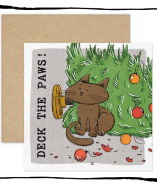 Brown cat sitting beside a fallen Christmas tree and broken baubles on a Deck the Paws Christmas card.