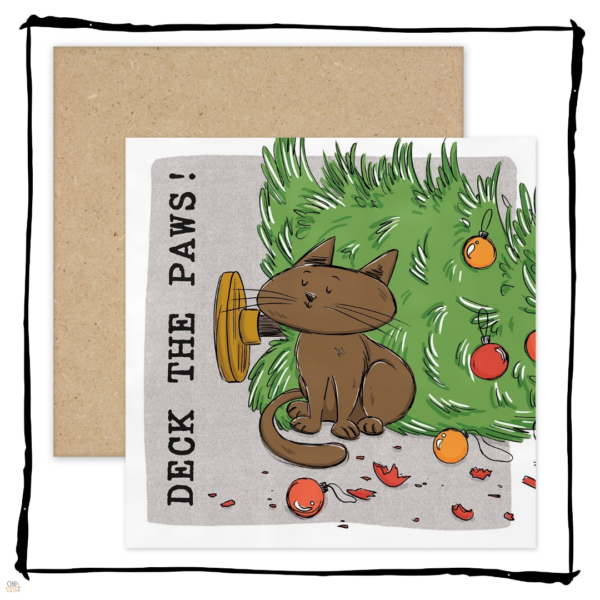 Brown cat sitting beside a fallen Christmas tree and broken baubles on a Deck the Paws Christmas card.