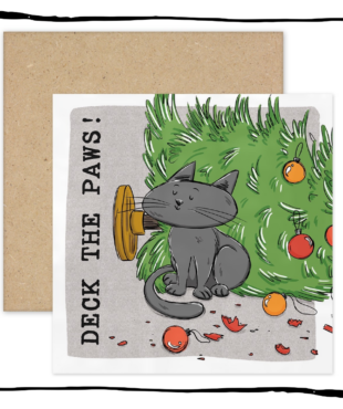 Grey cat sitting beside a fallen Christmas tree and broken baubles on a Deck the Paws Christmas card.
